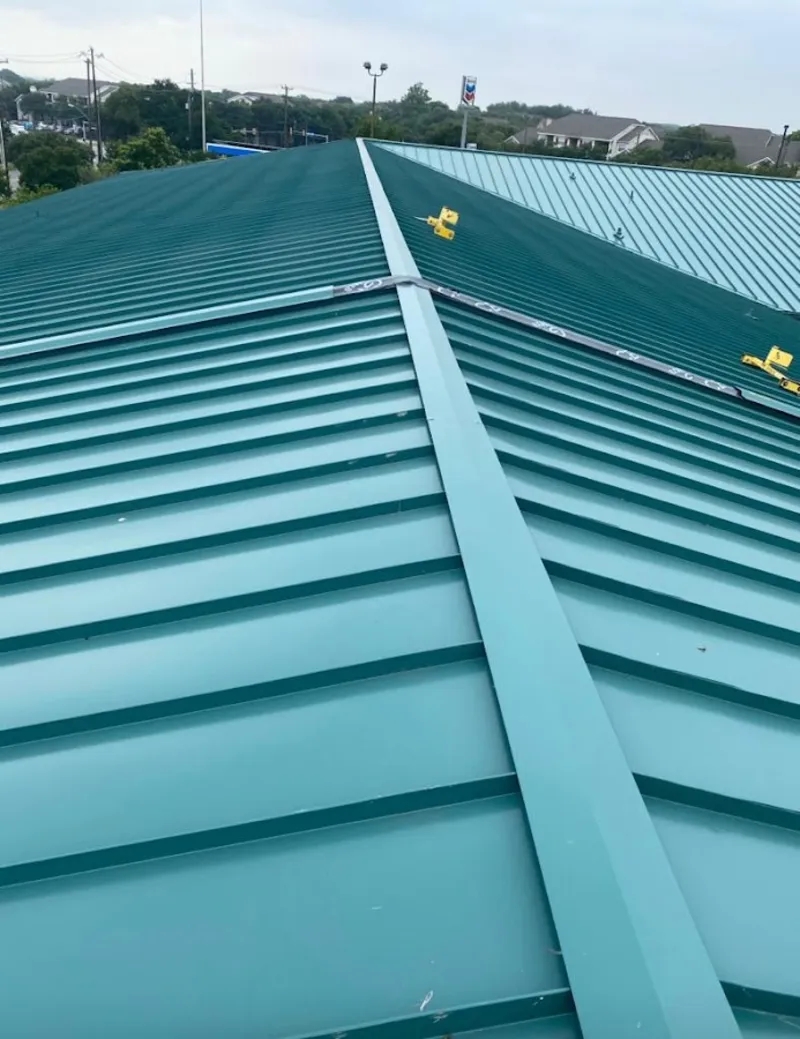 Green commercial metal roof ridge and valley for Metal Roof Repair in Stevens Point